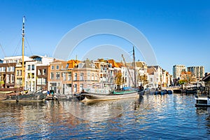 Scenic image of boats and houses in the the city of Leiden, Holland photo