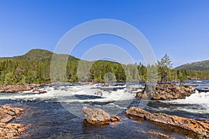 A picturesque view of the cascading Namsen River in Namsskogan, Trondelag, Norway,