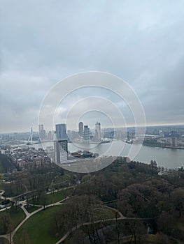 Picturesque view of city with buildings and park on cloudy day