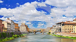 Picturesque view on colorful Ponte Vecchio over Arno River in Florence, Italy