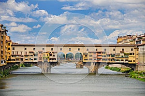 Picturesque view on colorful Ponte Vecchio over Arno River in Florence, Italy