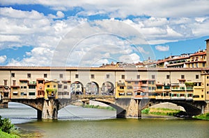 Picturesque view on colorful Ponte Vecchio over Arno River in Florence, Italy