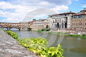 Picturesque view on colorful Ponte Vecchio over Arno River in Florence, Italy