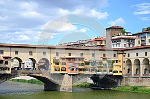 Picturesque view on colorful Ponte Vecchio over Arno River in Florence, Italy