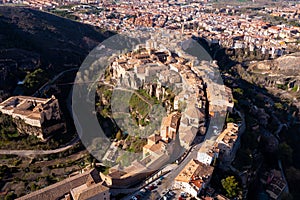 Drone view of Cuenca city on spur above gorge on spring day photo