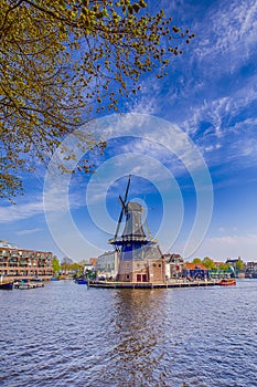 Picturesque View of Harlem Cityscape With De Adriaan Windmill on Spaarne River