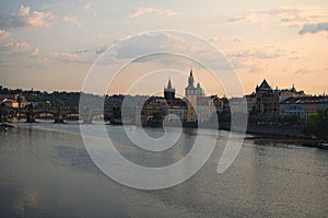 Picturesque view of the historical part of the city Prague during sunrise. Medieval Charles Bridge over Vltava River