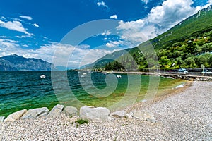 Picturesque view of Lake Garda with green mountains in the background. Italy.