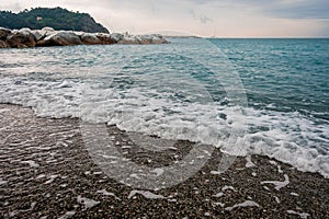 Picturesque view of the Ligurian sea. The cleanest pebble beach.