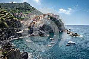 Picturesque view of Manarola village, nestled in the rocky cliffs of Cinque Terre, Liguria, Italy.