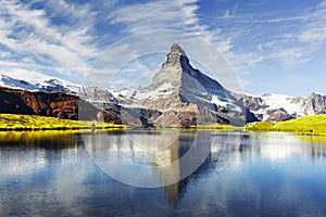 Picturesque view of Matterhorn peak and Stellisee lake in Swiss Alps