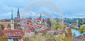 Picturesque view on medieval cityscape with typical townhouses and spires of churches, Bern, Switzerland