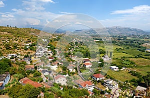 Picturesque view of neighborhoods Skodra in Albania on the background of mountains at sunny summer day, seen from Rozafa fortress