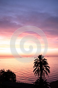 Picturesque view of seacoast of Tarragona under cloudy sky in sunset