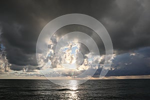 Picturesque view of sky with heavy rainy clouds over sea