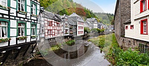 Picturesque view of traditional half timbered houses along the Rur river in the historic centre of Monschau, Germany.