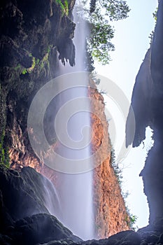 Picturesque view on the waterfall `Cola de caballo` from the cave `Gruta iris`