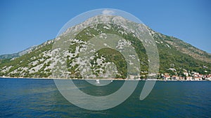 A picturesque view of the waters of the Bay of Kotor and the hig