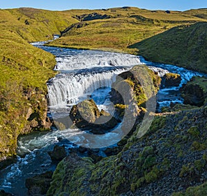 Picturesque waterfall Fosstorfufoss autumn view, southwest Iceland photo
