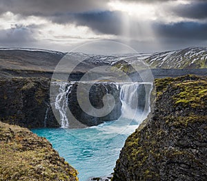 Picturesque waterfall Sigoldufoss autumn view. Season changing in southern Highlands of Iceland