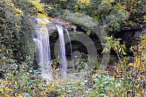 Picturesque waterfall surrounded by vibrant autumn foliage