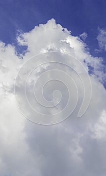 Picturesque white cloud in the blue sky, vertical format