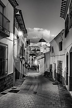 Picturesque white village at dusk in Andalusia, Velez Rubio, black and white photo. photo