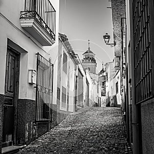 Picturesque white village at dusk in Andalusia, Velez Rubio, black and white photo. photo