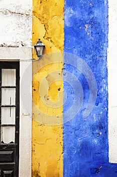 Picturesque yellow and blue wall, Obidos, Portugal