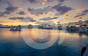 The pictursque port of Sitia, Crete, Greece at sunset. Sitia is a traditional town at the east Crete near the beach of palm trees,