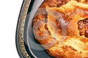 Pie with cabbage on a tray, isolated on a white background, on the right side of the frame