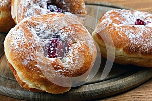 Pie and fruitcakes in plates on a table