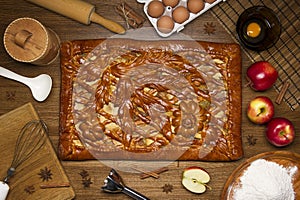 Pie with ingredients and tools for cooking
