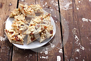 Pie with jam on a wooden background. Homemade pastries in a rustic style.