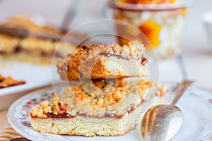 Pie pastry with apple jam and a cup of tea