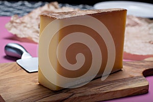 Piece of aged Comte or Gruyere de Comte, AOC French cheese made from unpasteurized cow's milk in the Franche-Comte region of