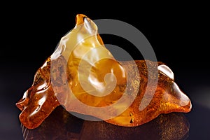 A piece amber on a black background