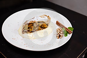 A piece of apetite strudel on a white plate photo