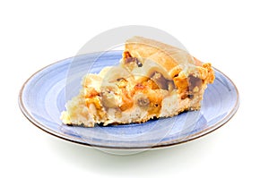 Piece of apple pie on blue plate