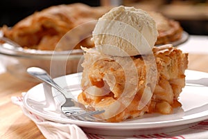 Piece of apple pie and vanilla ice cream