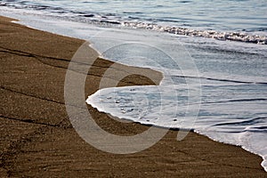 A piece of beach. Wet sand. photo
