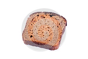 Piece of black bread on white background