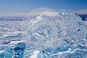 A piece of blue ice on the surface of the frozen Lake Baikal
