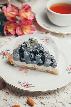 A piece of blueberry cake on a white plate