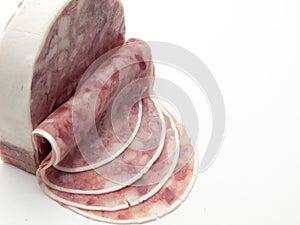 Piece of boar head cut into slices on white background photo