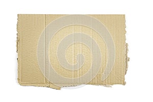 Piece of brown corrugated cardboard isolated on white background. Ripped kraft carton paper card. Cardboard torn edge