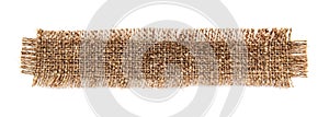 A piece of burlap fabric on a white background. Burlap texture isolate closeup