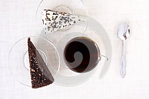 Piece cake. Black tea. Transparent tableware