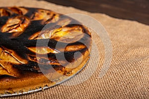 piece of cake. failed apple pie. burnt on top and the dough did not rise during baking. textured burnt pie crust. photo
