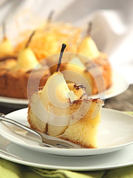 Piece of cake with pears with spun sugar strands. photo